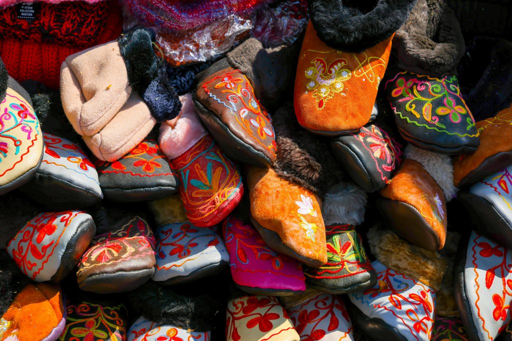 pexels-photo-12024998-12024998 A Pile of Soft Shoes with Embroideries