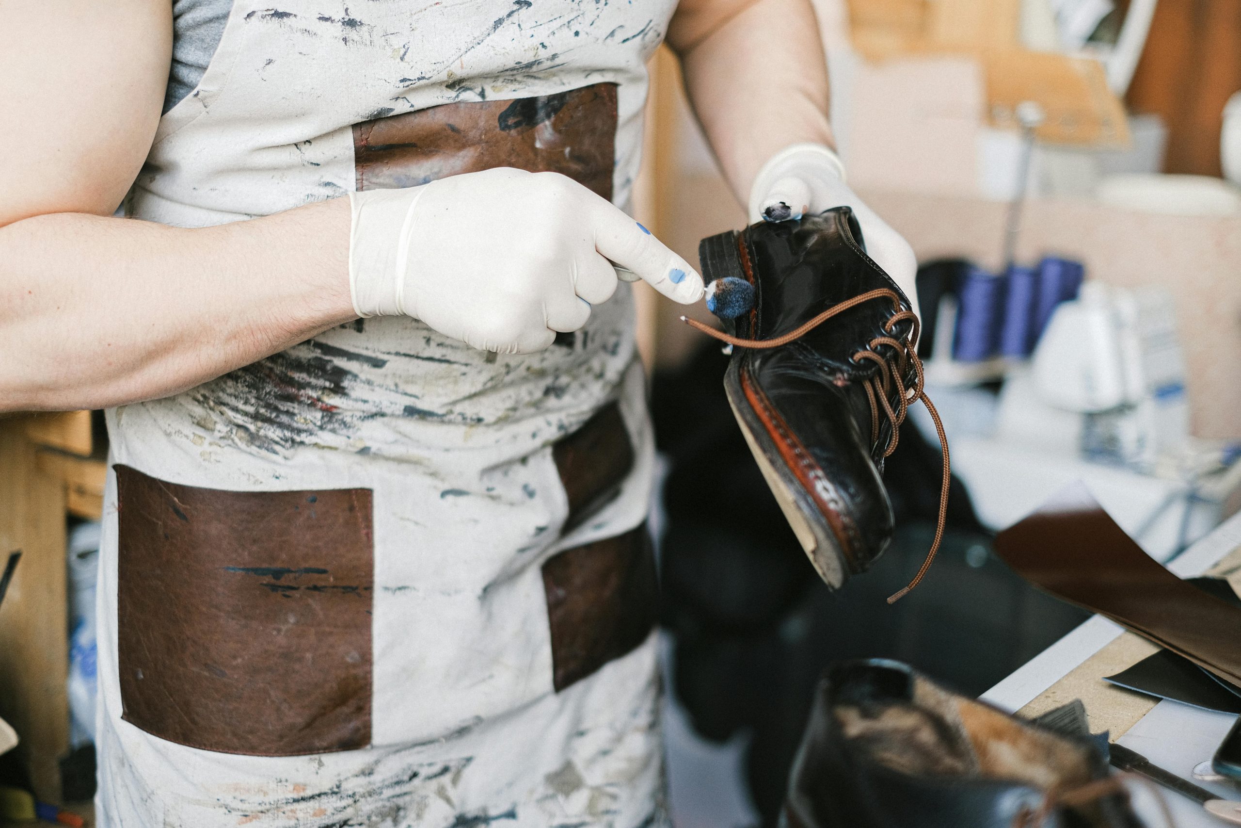 pexels-photo-5894310-5894310 A Person holding a Black leather Shoes